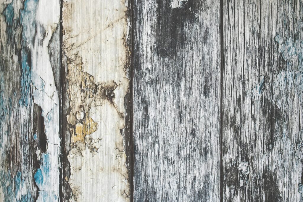Close-up of rustic weathered wooden planks with distinctive texture and aging patterns.